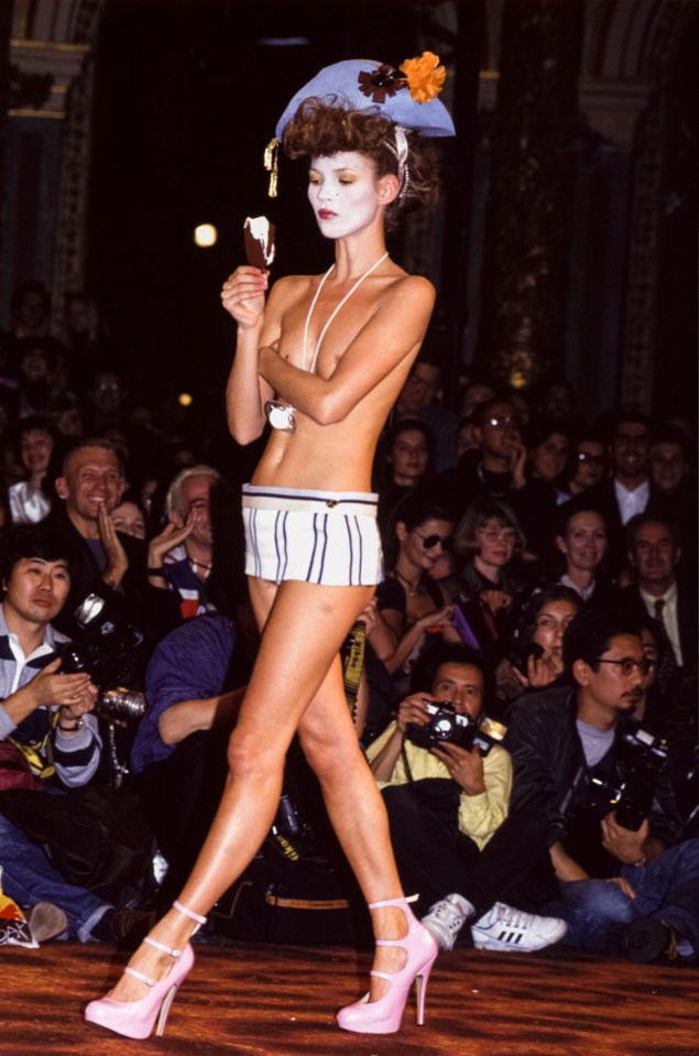Kate Moss in a Vivienne Westwood fashion show, eating an ice cream bar.