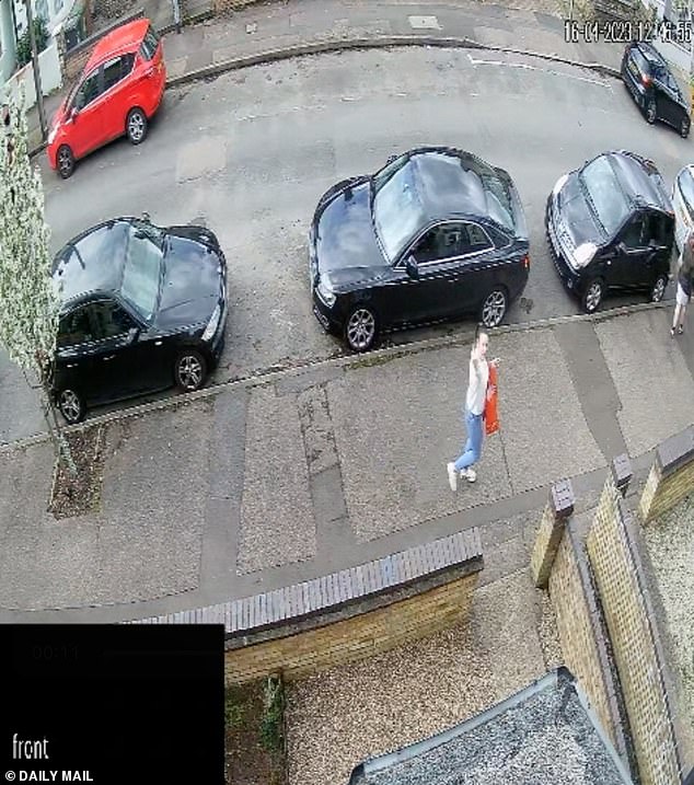 The pensioners say they lived next to the neighbour from hell. Lloyd is seen here putting her middle finger up at the camera while her children walk in front