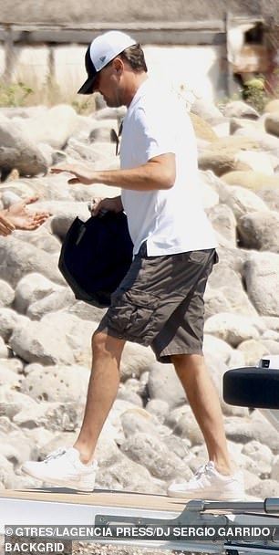 Leo dressed casually as usual and wore his trademark cap