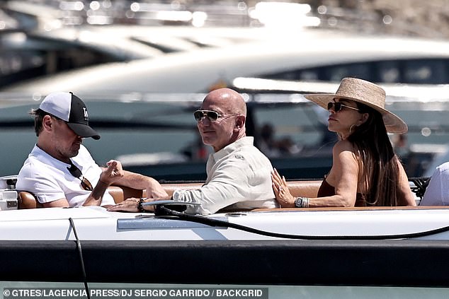 She affectionately touched his back on the boat