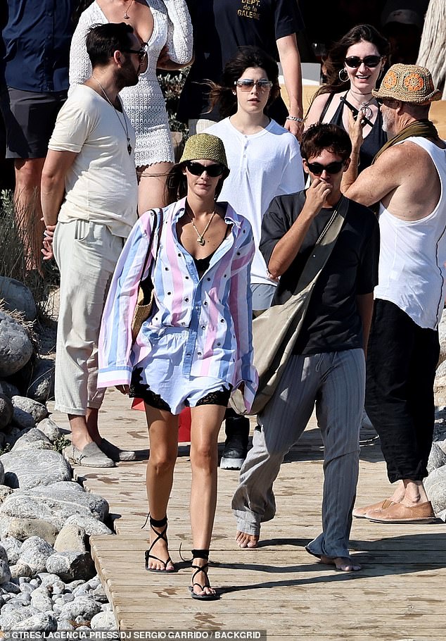 Model Vittoria looked stylish in a pink, white and blue shirt