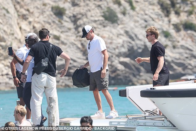 Leo added dark shorts to his look
