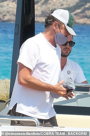 Meanwhile Leo wore a white t-shirt