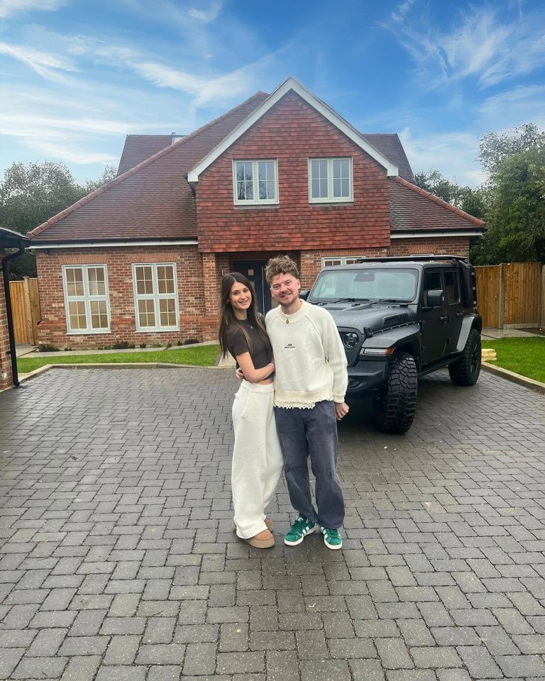 Conor Maynard and Charlotte Chilton standing in front of a house and car.