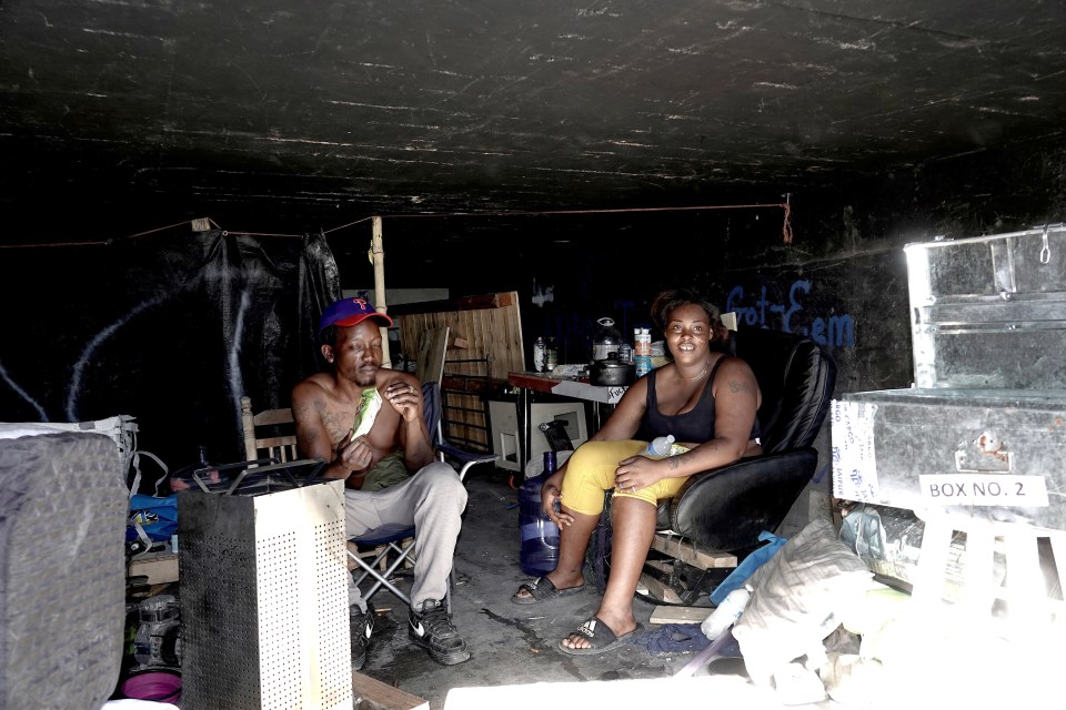 Two homeless people in a Las Vegas tunnel.
