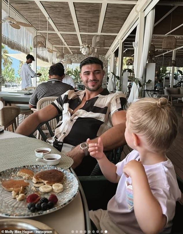The family relaxed while eating breakfast at the resorts beach front restaurant