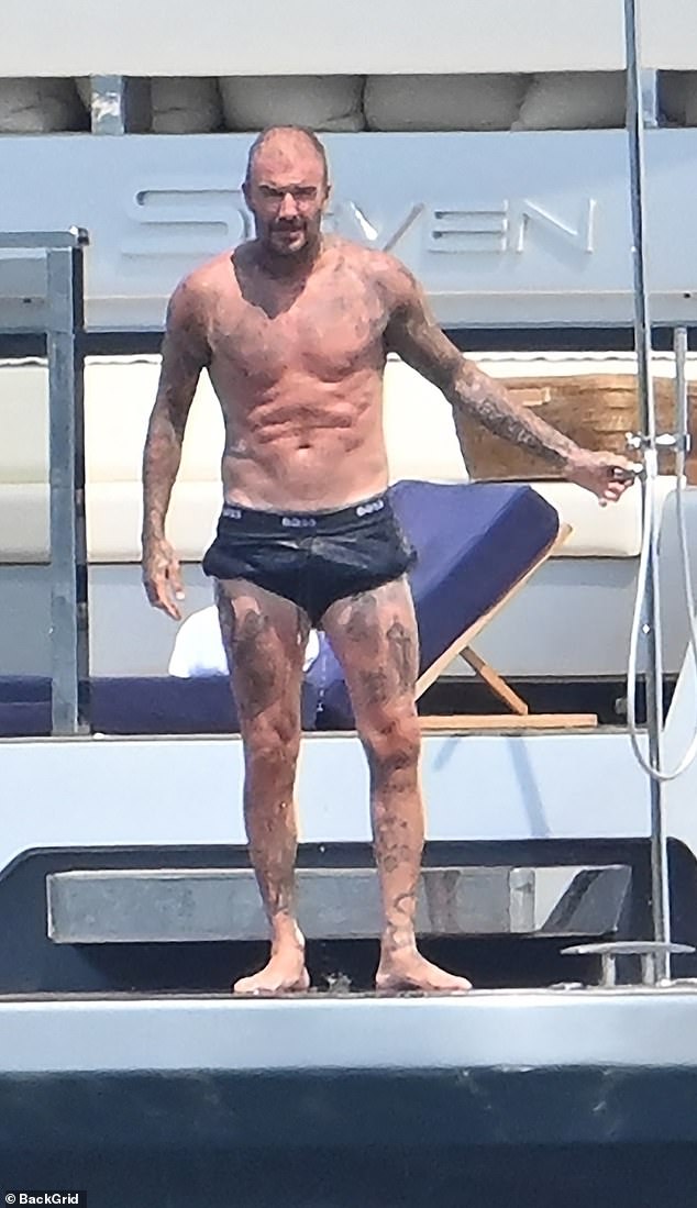 David is known for his gruelling hours in the gym - which was clear to see on the holiday