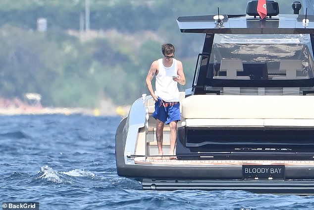 Cruz looked contemplative as he stood on the yacht