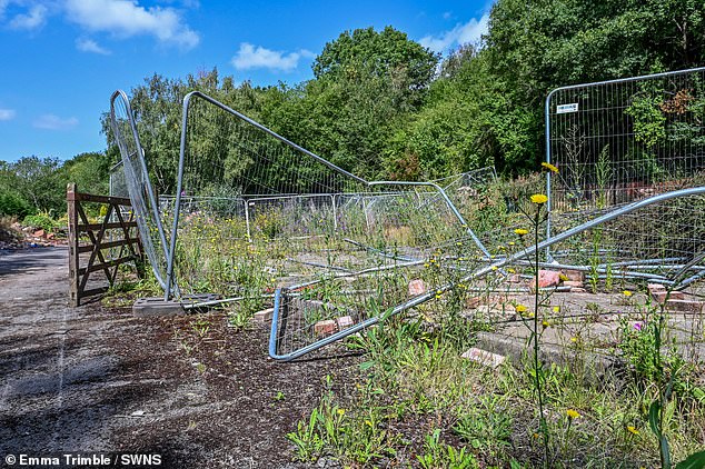 Destroyed fences lay abandoned (pictured) after landslips caused them to come down - while drugs paraphernalia can also be seen littering the area