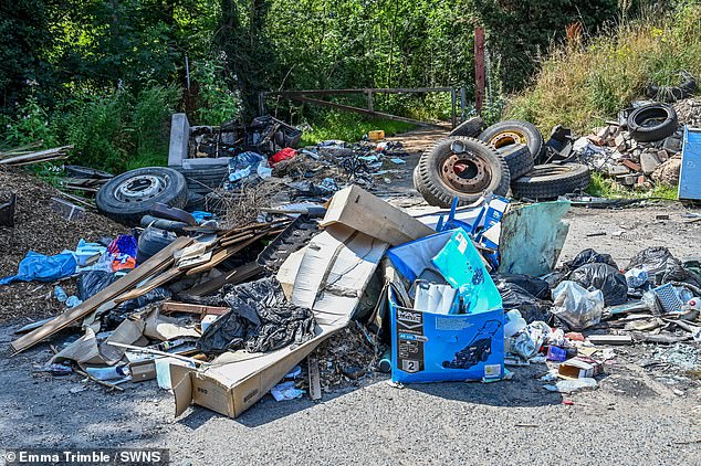 While the furore drags on, the site of the Black Country alehouse, near Dudley, has become a 'decaying dumping ground' (pictured)