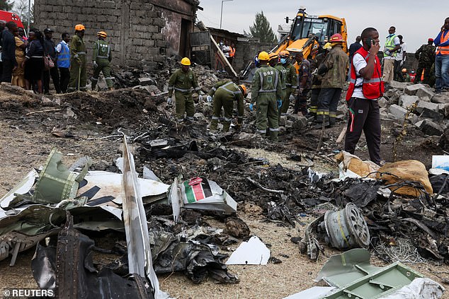 Emergency services work at the scene of the plane crash in Kenya