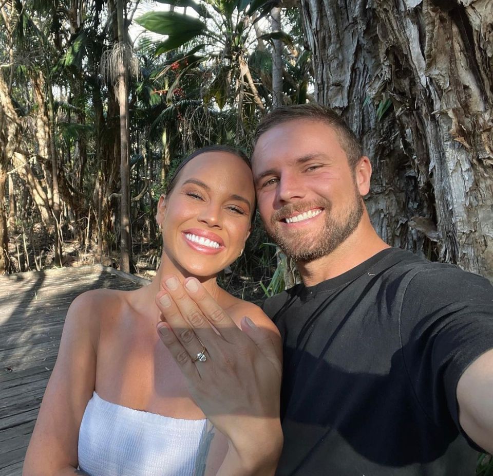 Bonnie Anderson and her fiancé showing off her engagement ring.