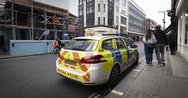 A police car parked in Soho after the area has become the UK's number one burglary hotspot
