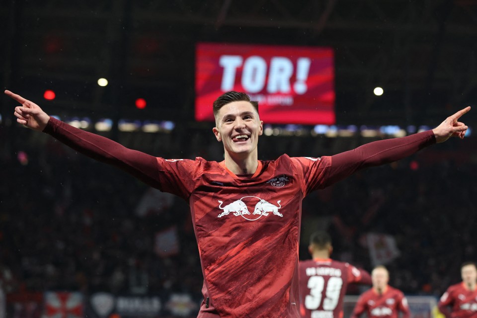 Benjamin Sesko of RB Leipzig celebrates scoring a goal.