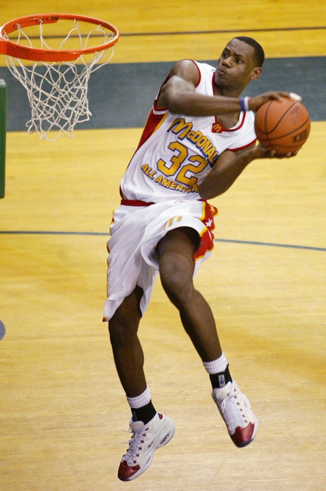 LeBron James dunking a basketball.