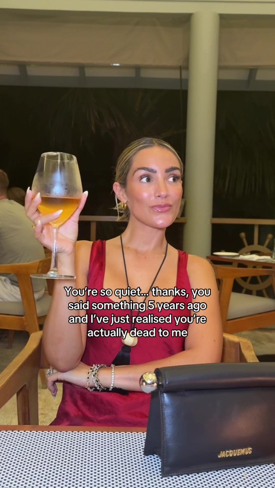 Woman holding a glass of wine and saying "You're so quiet... thanks, you said something 5 years ago and I've just realised you're actually dead to me".