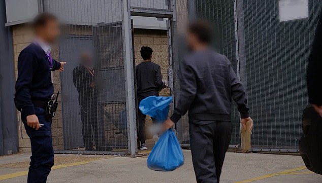 The first migrants selected to return were seen being detained by British officials yesterday