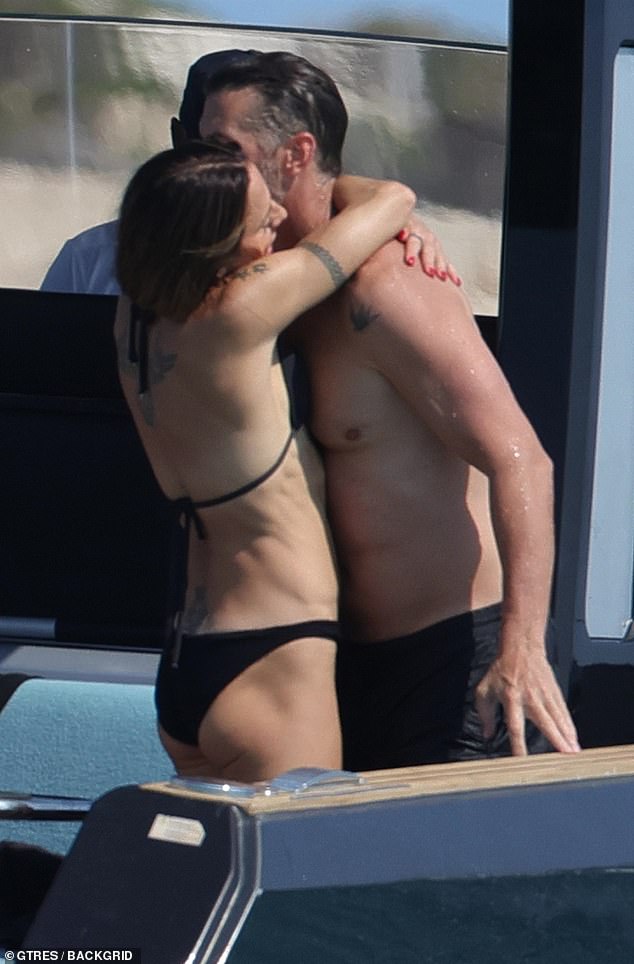 She was spotted on a boat off Ibiza this week, laughing and hugging her model boyfriend Chris Dingwall. But it was her extraordinary physique, that captured the most attention