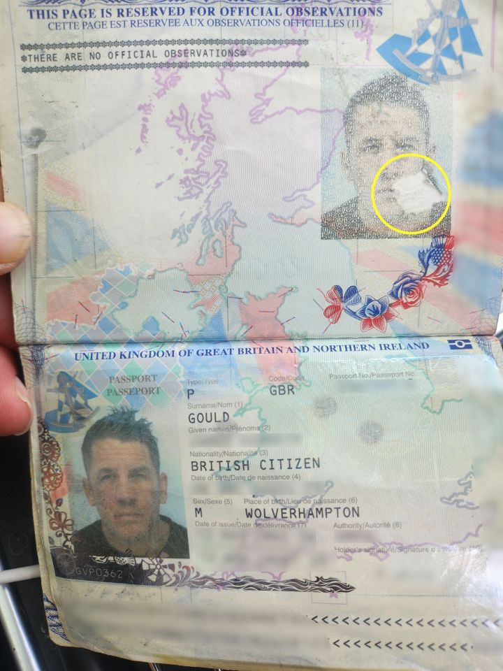 Passport with a small tear.