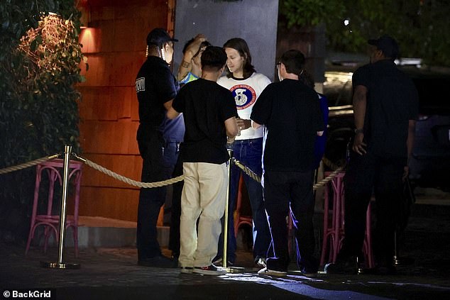 The actor was seen chatting with guests outside the bar