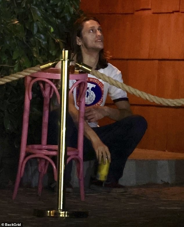 The actor was seen sipping on a drink during a break