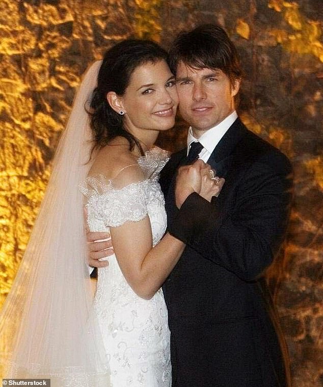 Tom Cruise and Holmes, wearing an off-the-shoulder Giorgio Armani gown with an ivory silk train, on their wedding day in Italy in 2006
