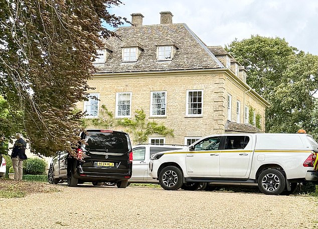 A host of black and white cars can be seen parked in the driveway of Mr Vance's new rented property