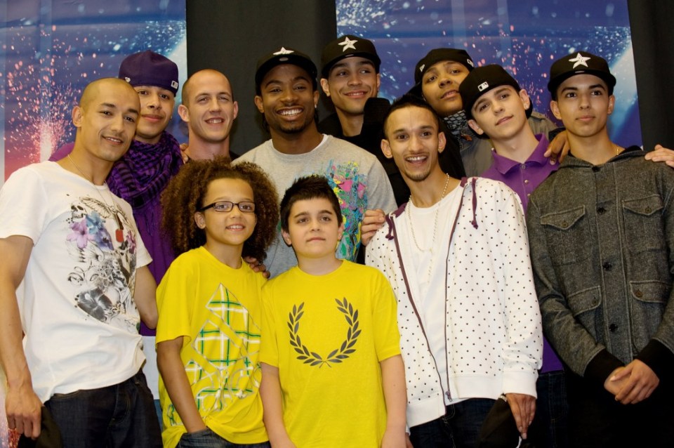 Ian (L), Warren (2L), Terry (3-L), Perry (4L), Ike (5L), Mitchell (C), Ashley (5R), Jamie (4R), Jordan (3R), Sam (2R) and Matthew (R) of dance group "Diversity" pose for photographs at a press conference in West London on May 31, 2009, following their victory in the final of television talent search "Britain's Got Talent". The group beat bookmakers favourite Susan Boyle to claim £100,000 and the chance to perform at the Royal Variety Performance. AFP PHOTO/Leon NEAL (Photo credit should read Leon Neal/AFP/Getty Images)