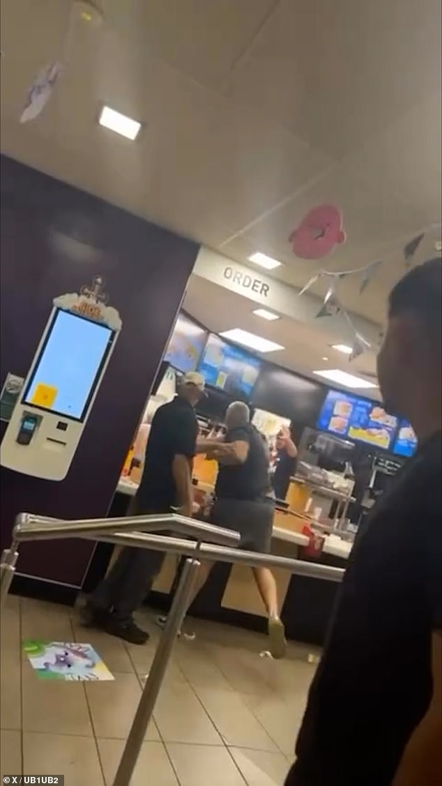 The fight (pictured) appears to have taken place in a branch of the fast food restaurant chain in the Acton area of west London