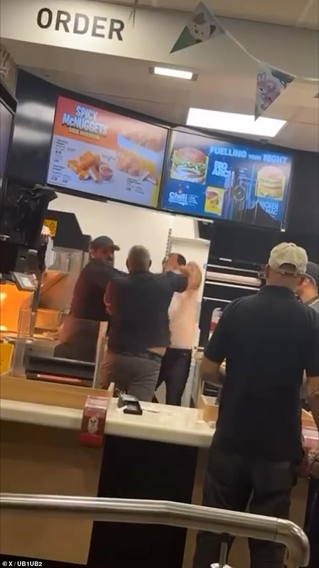 The astonishing video (pictured), posted to social media platform X yesterday afternoon, sees a raging customer appear to throw something violently over the counter