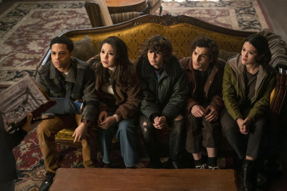 Goosebumps cast members sitting on a couch.