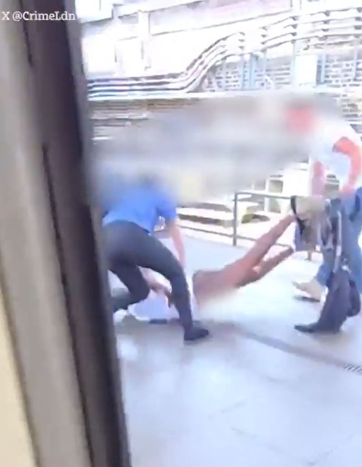 People helping a person lying on the ground.