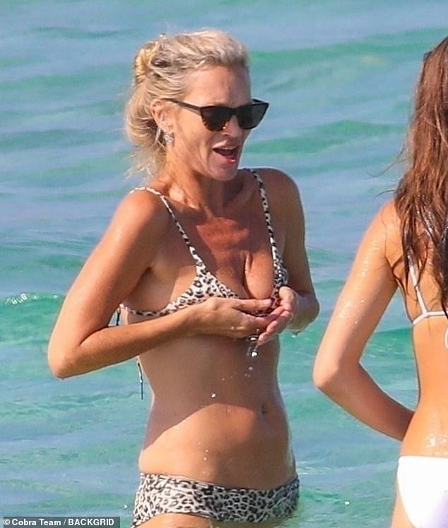 Kate came close to a wardrobe malfunction when she waded into the sea, with the star seen grabbing her bikini top