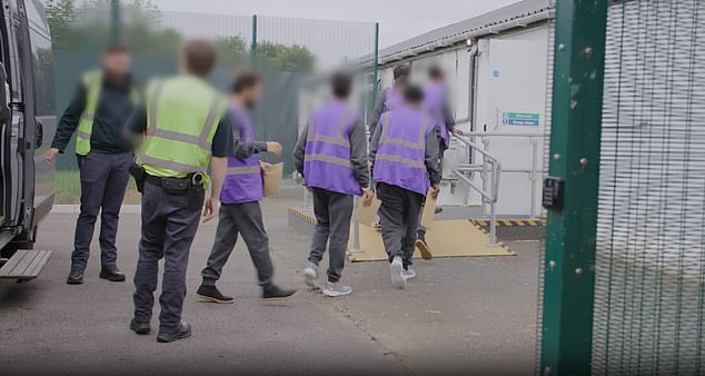 The Home Office released images of the first migrants - wearing purple tabards - who have been selected for return to France under the treaty