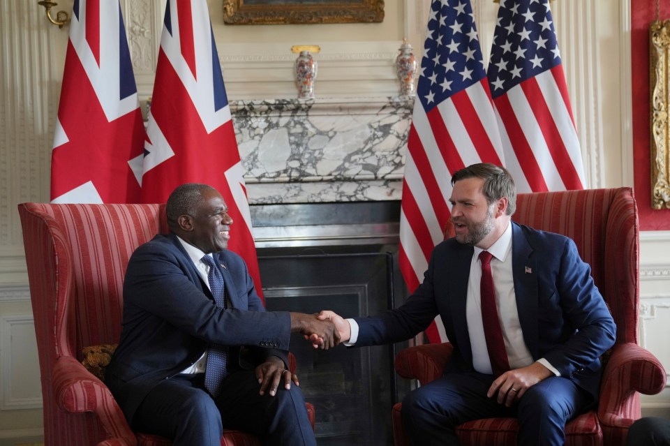 Vice President JD Vance shaking hands with Britain's Foreign Secretary David Lammy.
