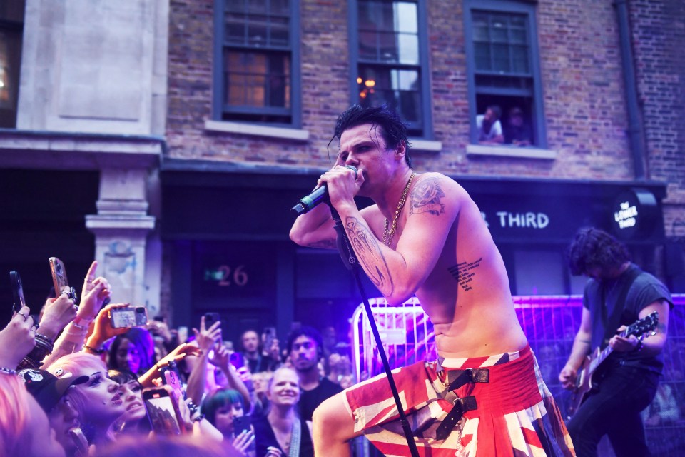 Yungblud performing on stage.