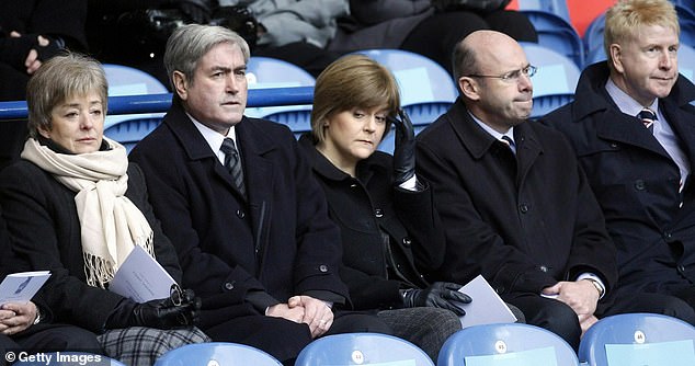 Ms Sturgeon said she was 'desolate and heartbroken' after losing her baby in 2010 and confessed she new she would never have another opportunity to become a mother (Pictured at a memorial service for the Ibrox disaster days after her misacarriage)