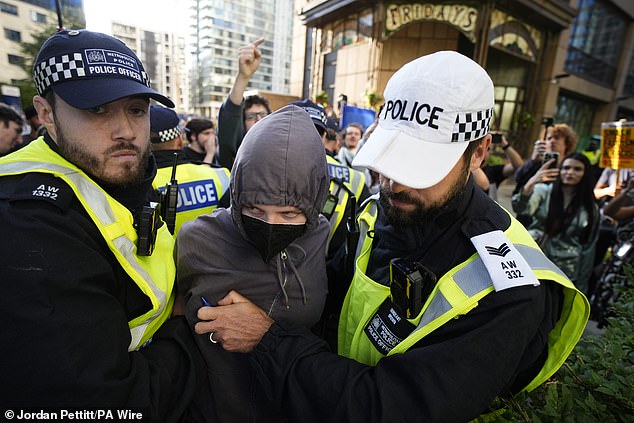 A member of the counter-protest group has been arrested for failing to remove a face covering