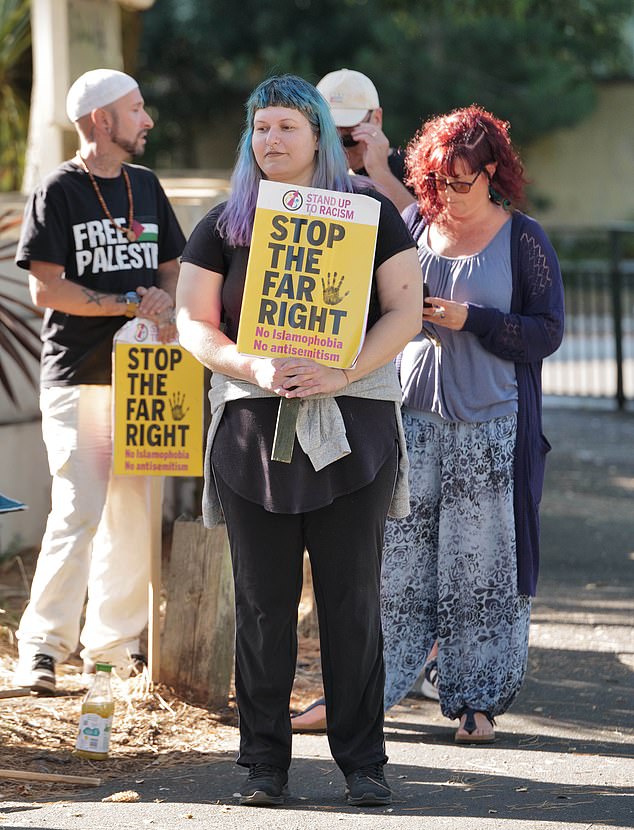 Counter protestors are also in attendance, holding signs that say 'refugees welcome' and 'stop the far right'