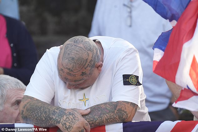 One protestor had a 'f*** the government' tattoo on his scalp as well as a bull dog