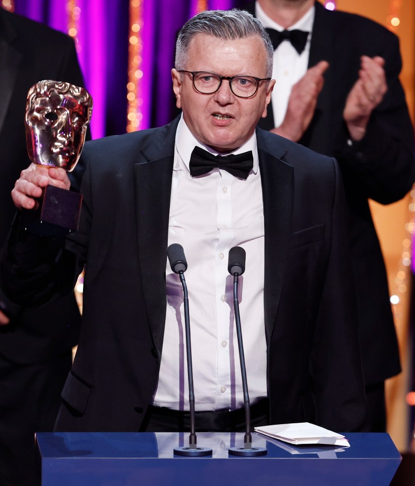 Richard Frediani accepting a BAFTA award.