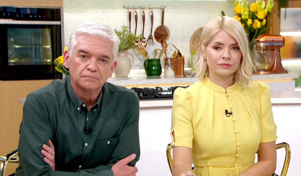 Phil and Holly, This Morning presenters, appearing somber.