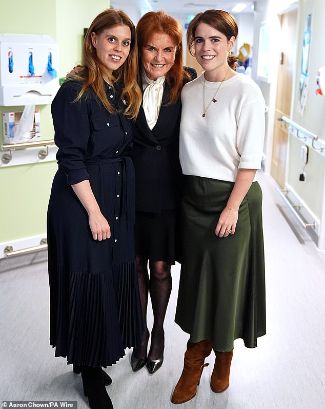 Pictured: Sarah, Duchess of York posed for a photo with her daughters Beatrice and Eugenie during a visit to the Teenage Cancer Trust unit at University College Hospital, London