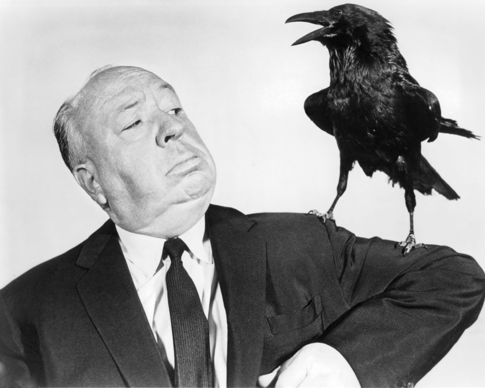 Alfred Hitchcock with a crow.