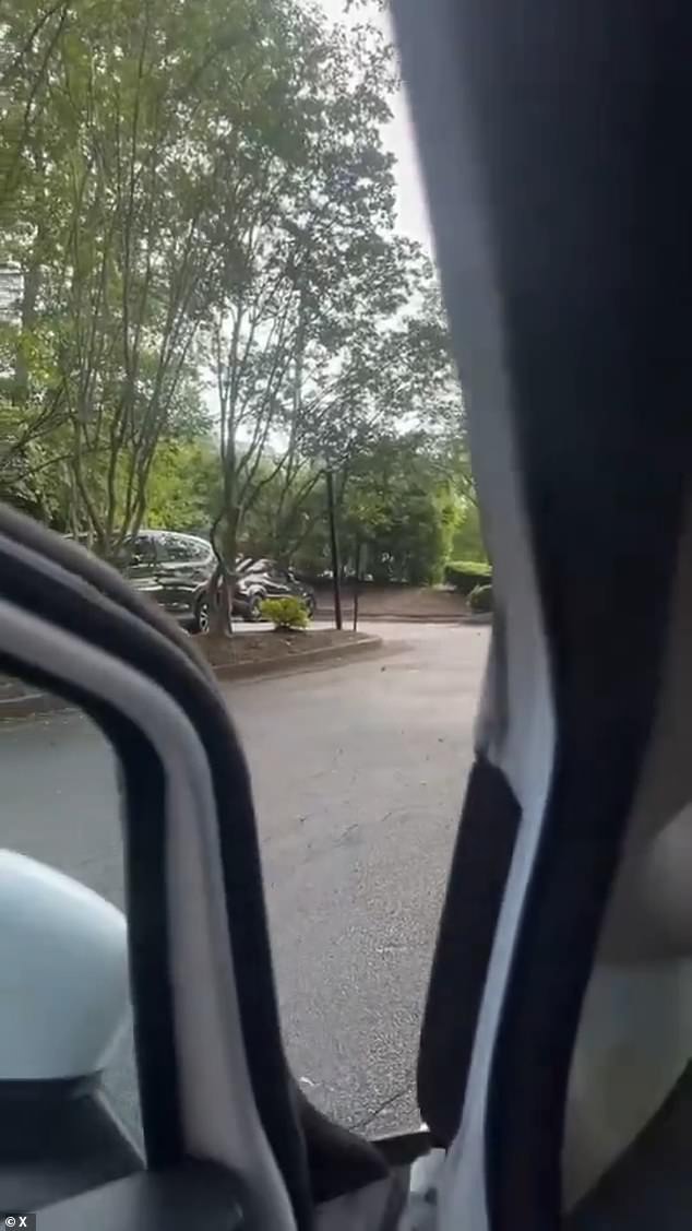 Pictured: A man took a video from inside his car near the area of the shooting