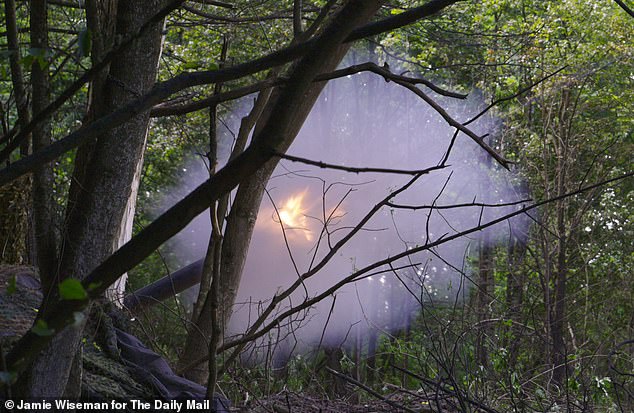 Gunfire and smoke fill the air as a British designed M777 howitzer artillery gun is operated by the Kraken Regiment