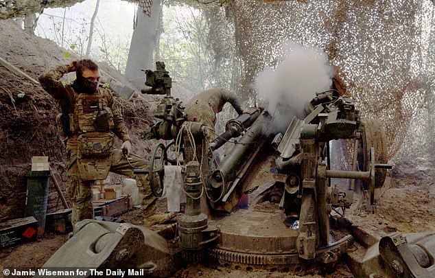 The crew prepare for the day ahead and ensure their M777 howitzer artillery gun is ready