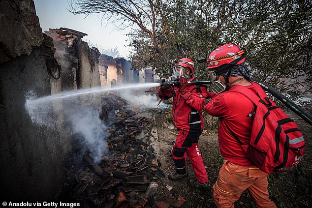 Firefighters conduct extinguishing works on the ground in the Bayramic district of Canakkale, Turkiye on August 8, 2025
