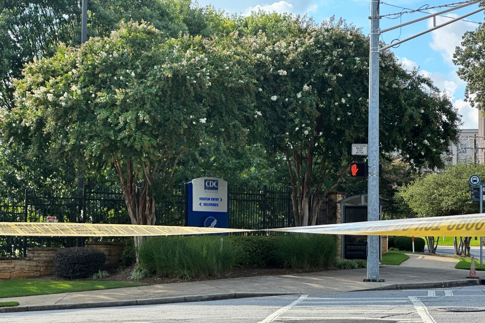 CDC headquarters with police tape across the entrance.