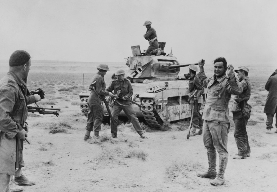 New Zealand soldiers accepting the surrender of a German tank crew during WWII.